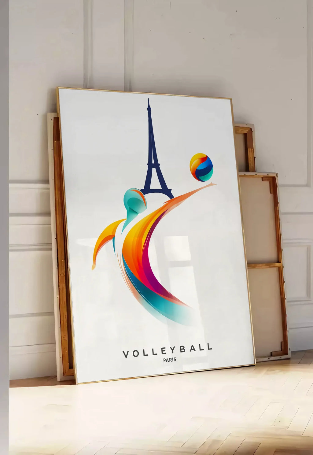 Tirage encadrable joueur de volley stylisé devant la silhouette de la Tour Eiffel, posee au sol dans une entree lumineuse, contre un mur a panneaux blancs, a cote de chassis en bois empiles